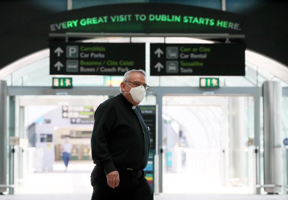 A priest wearing a protective face mask at Terminal 2 in Dublin Airport (Brian Lawless/PA Wire/PA Images)