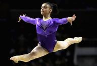 <p>Her signature floor exercises and beam routines earn top scores due to her personality and confidence. Her favorite training music? EDM or rap. (Getty) </p>
