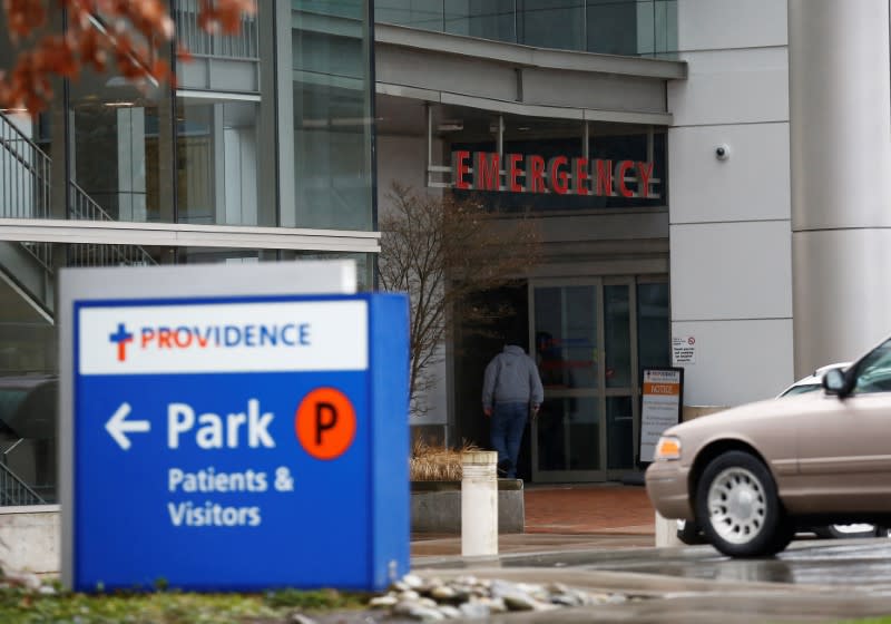 A man walks into the emergency room entrance at Providence Regional Medical Center after coronavirus victim treated in Everett