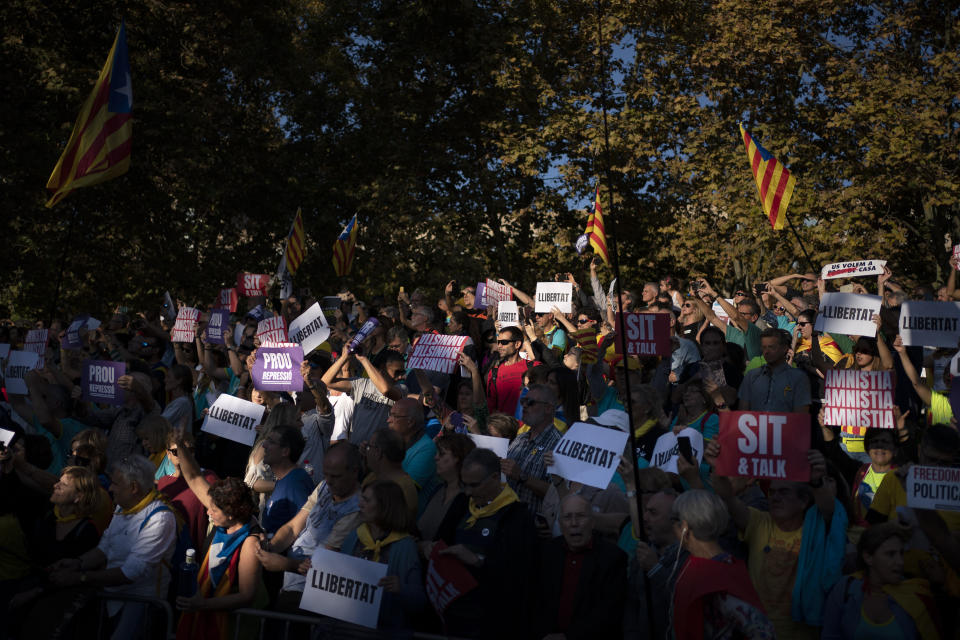 Catalan pro-independence protesters gather during a demonstration in Barcelona, Spain, Saturday, Oct. 26, 2019. Protests turned violent last week after Spain's Supreme Court convicted 12 separatist leaders of illegally promoting the wealthy Catalonia region's independence and sentenced nine of them to prison. (AP Photo/Felipe Dana)