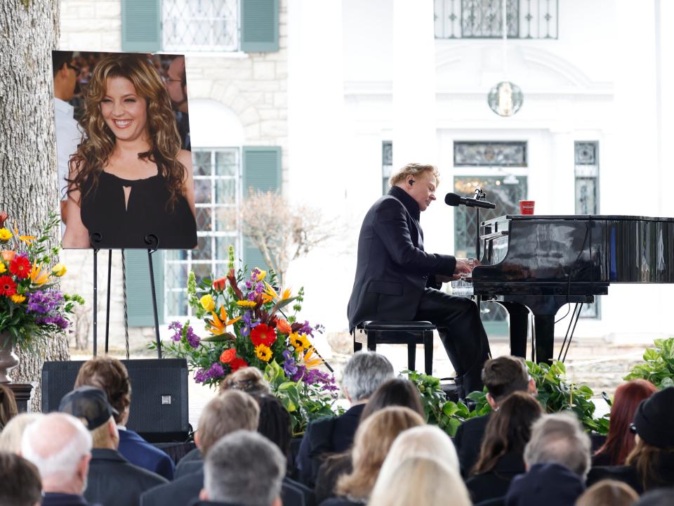 Axl Rose playing the piano and singing at Lisa Marie Presley's memorial.