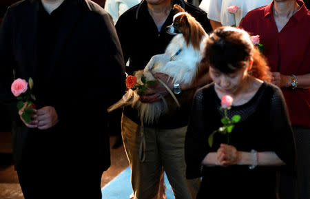 Visitors attend a demonstration of pet funeral services at the Pet Rainbow Festa, a pet funeral expo targeting an aging pet population, in Tokyo, Japan September 18, 2017. REUTERS/Kim Kyung-Hoon