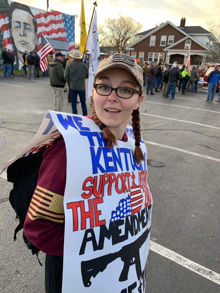 Courtney Griffieth wears a protest sign during a Jan. 7 gun-rights rally at the Kentucky statehouse.