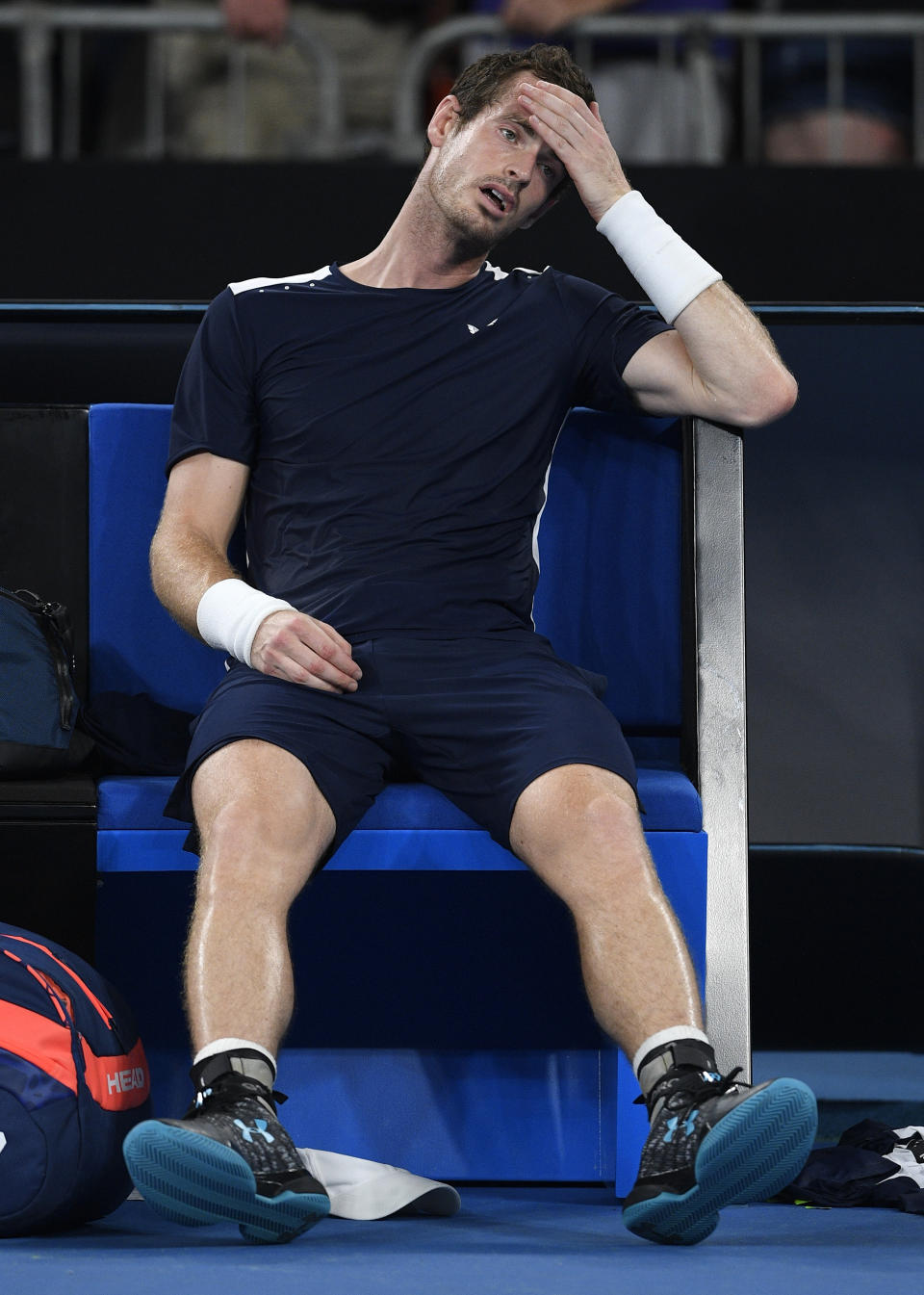 FILE - In this Monday, Jan. 14, 2019 file photo Britain's Andy Murray reacts after his first round loss to Spain's Roberto Bautista Agut at the Australian Open tennis championships in Melbourne, Australia. Former world number one Murray's participation at the upcoming Australian Open is in doubt after the Briton tested positive for COVID-19. (AP Photo/Andy Brownbill, File)