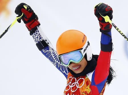 Vanessa Mae, competing for Thailand under her father's name Vanessa Vanakorn, reacts in the finish area after competing in the first run of the women's alpine skiing giant slalom event during the 2014 Sochi Winter Olympics at the Rosa Khutor Alpine Center February 18, 2014. REUTERS/Kai Pfaffenbach