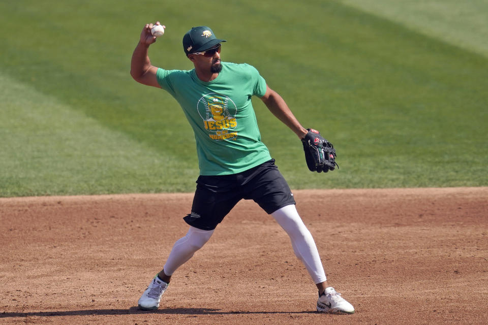 Oakland Athletics' Marcus Semien throws during a baseball workout in Oakland, Calif., Monday, Sept. 28, 2020. The Athletics are scheduled to play the Chicago White Sox in an American League wild-card playoff series starting Tuesday. (AP Photo/Jeff Chiu)