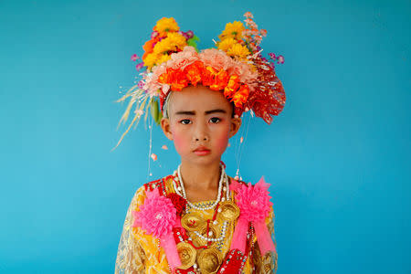 Danusorn Sdisaithaworn, 10, poses for a portrait during an annual Poy Sang Long celebration, a traditional rite of passage for boys to be initiated as Buddhist novices, while he visits a relative's house outside Mae Hong Son, Thailand, April 4, 2018. REUTERS/Jorge Silva