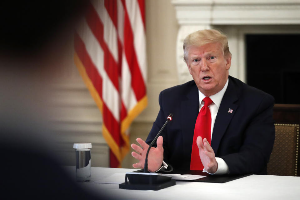 President Donald Trump speaks about reopening the country, during a roundtable with industry executives, in the State Dinning Room of the White House, Wednesday, April 29, 2020, in Washington. (AP Photo/Alex Brandon)