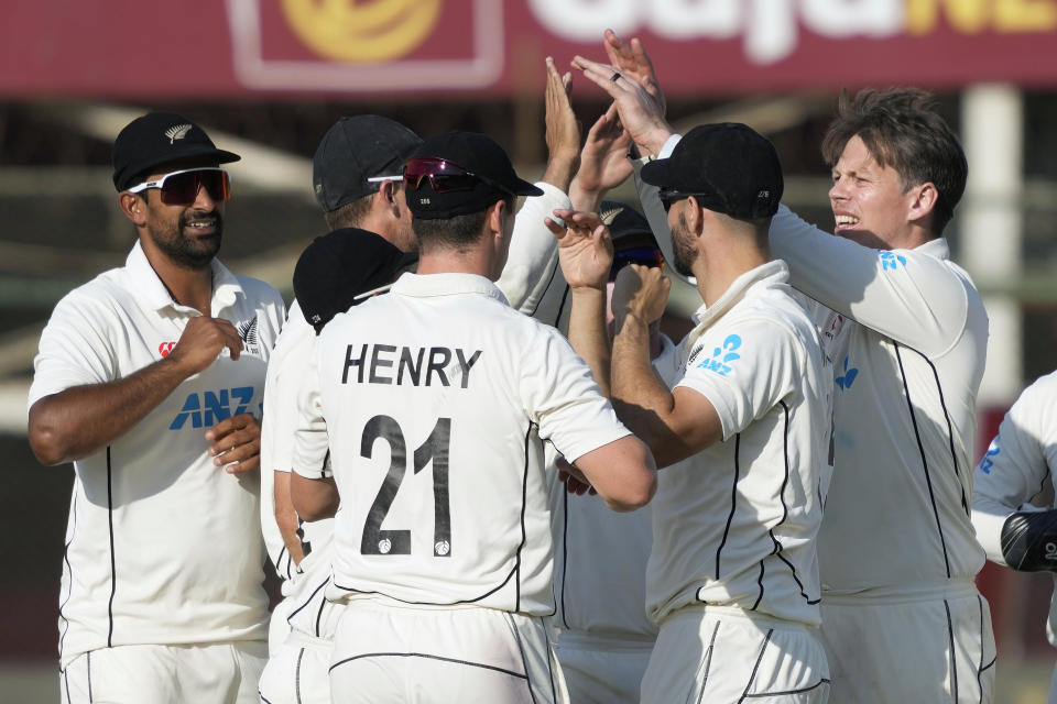 New Zealand's Michael Bracewell, right, celebrates with teammates after taking the wicket of Pakistan's Saud Shakeel during the fifth day of the second test cricket match between Pakistan and New Zealand, in Karachi, Pakistan, Friday, Jan. 6, 2023. (AP Photo/Fareed Khan)