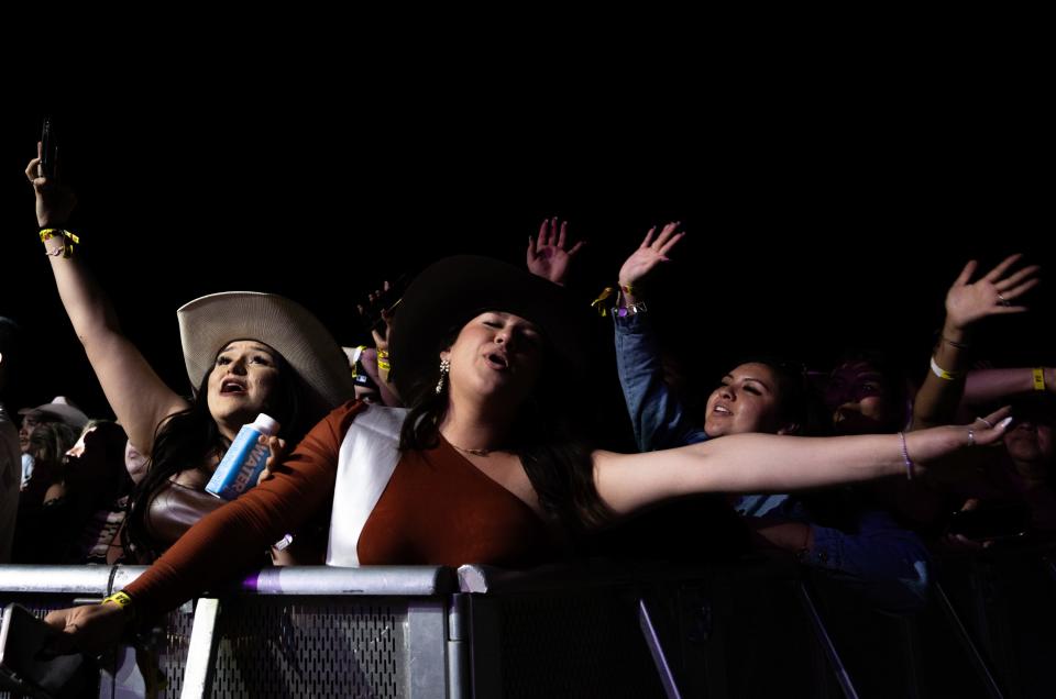 Fans sing along as Duelo performs at Besame Mucho Music Festival, March 2, 2024 at Circuit of the Americas in Austin, Texas.