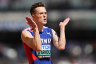 Karsten Warholm, of Norway limbers-up before starting a men's 400-meters hurdles heat during the World Athletics Championships in Budapest, Hungary, Sunday, Aug. 20, 2023. (AP Photo/Petr David Josek)