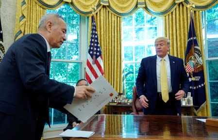 China's Vice Premier Liu speaks with U.S. President Trump during a meeting at the White House in Washington