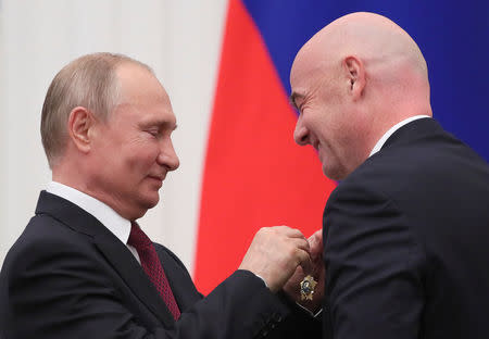 Russian President Vladimir Putin decorates FIFA President Gianni Infantino with the Order of Friendship during an awarding ceremony at the Kremlin in Moscow, Russia May 23, 2019. REUTERS/Evgenia Novozhenina