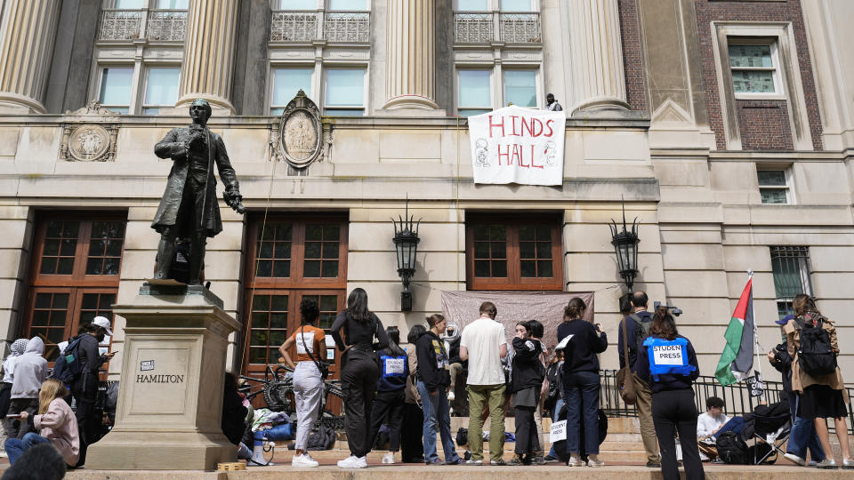 Student protesters camp near the entrance to Hamilton Hall on the campus of Columbia University, Tuesday, April 30, 2024, in New York. Early Tuesday, dozens of protesters took over Hamilton Hall, locking arms and carrying furniture and metal barricades to the building. Columbia responded by restricting access to campus. (AP Photo/Mary Altaffer, Pool)