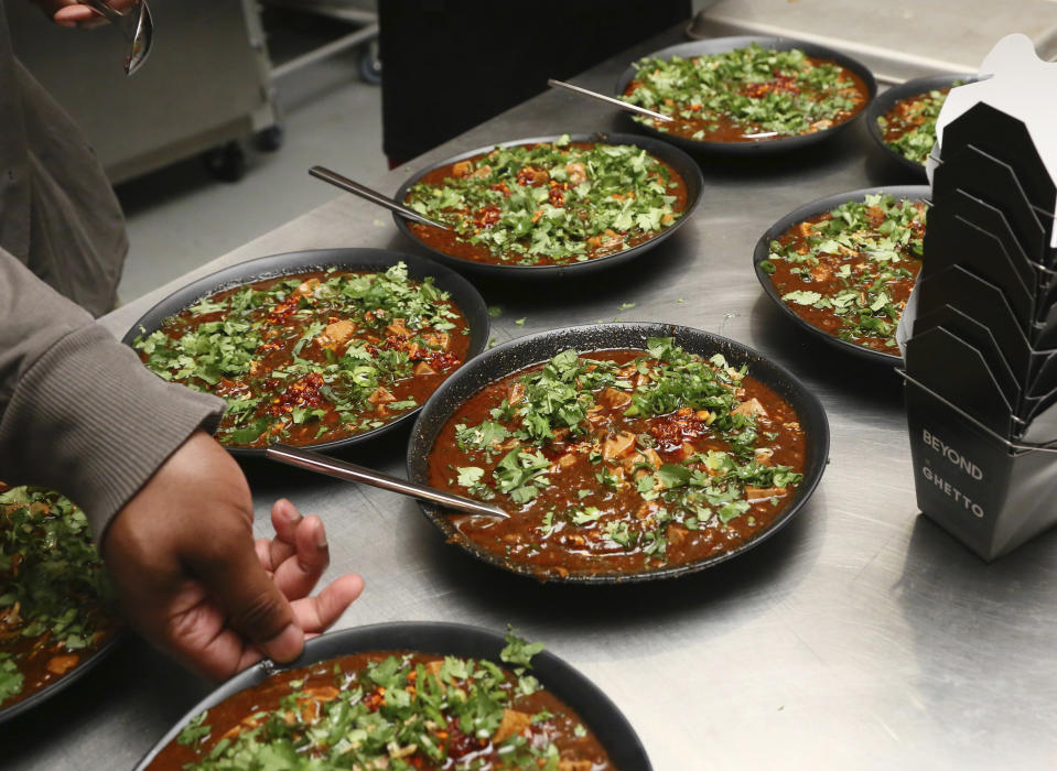 IMAGE DISTRIBUTED FOR BEYOND MEAT - Dinner is served as Beyond Meat previews their latest product innovation, Beyond Beef, at Ghetto Gastro's Labyrinth 1.1 in the Bronx, N.Y., Wednesday April 3, 2019. Beyond Meat is creating the Future of Protein by building meat directly from plants without soy, gluten or GMOs.(Stuart Ramson/AP Images for Beyond Meat)