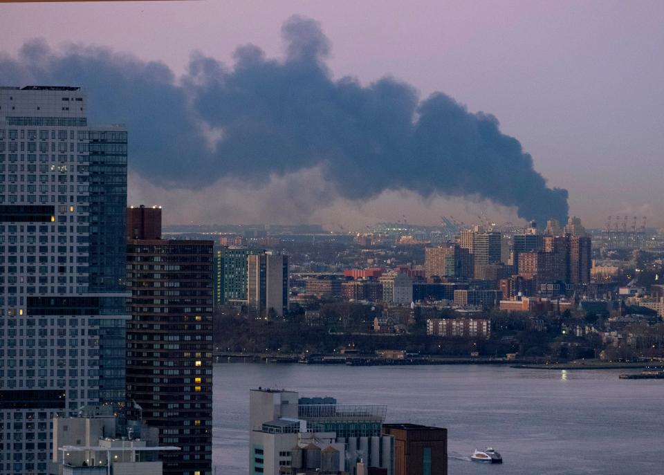 Smoke rises south of the New York borough of Manhattan as a warehouse burns in Elizabeth, N.J., spreading smoke over the southern skyline of New York Friday, Jan. 5, 2024. (AP Photo/Craig Ruttle) ORG XMIT: NYCR103