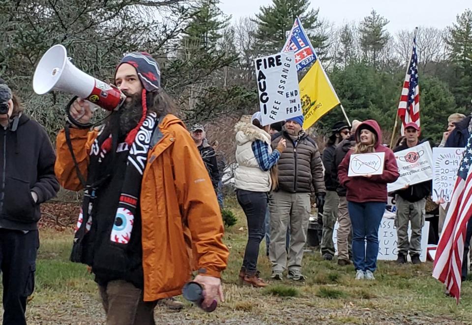 Frank Staples of Absolute Defiance leads a protest outside the home of New Hampshire Gov. Chris Sununu Sunday, Nov. 22, 2020, in Newfields.