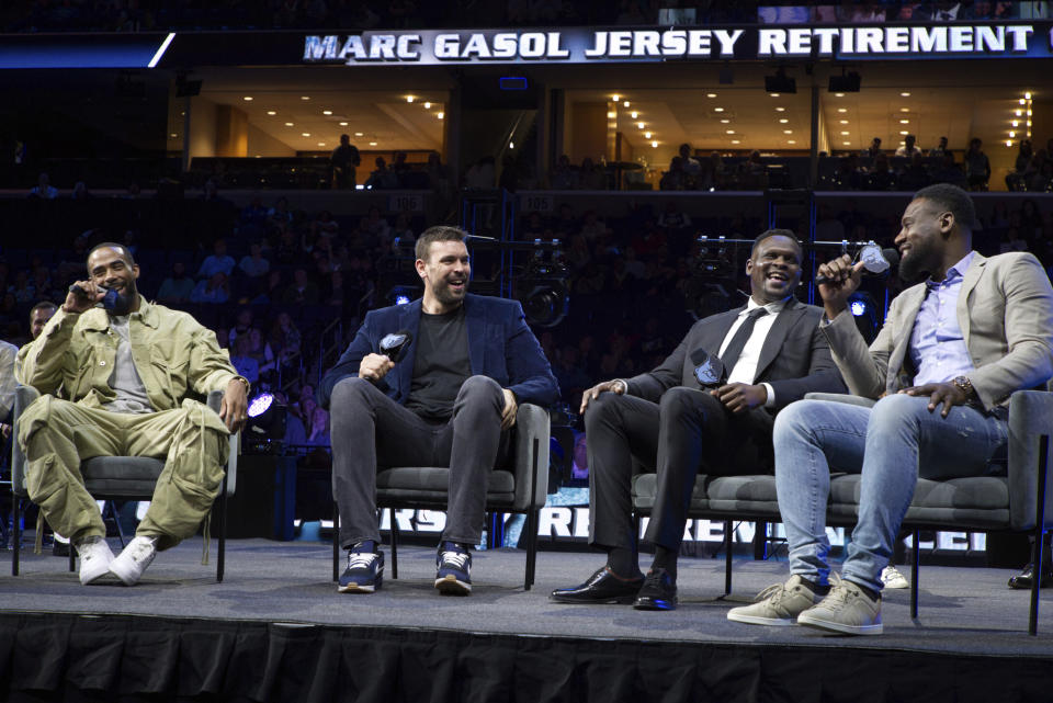 Marc Gasol, second from left, sits with former teammates Mike Conley, Zach Randolph and Tony Allen, from left, as the Memphis Grizzlies retire Gasol's No. 33 jersey following the team's NBA basketball game against the Philadelphia 76ers on Saturday, April 6, 2024, in Memphis, Tenn. (AP Photo/Nikki Boertman)