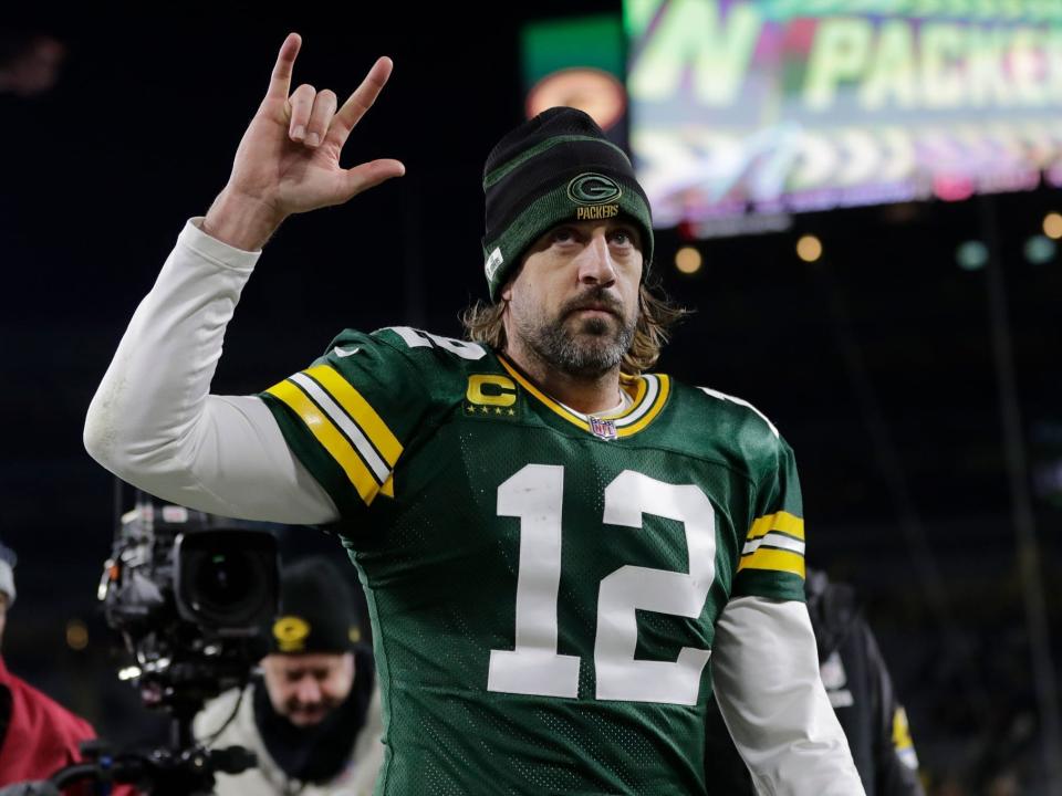 Aaron Rodgers walks off the field after a win against the Chicago Bears.