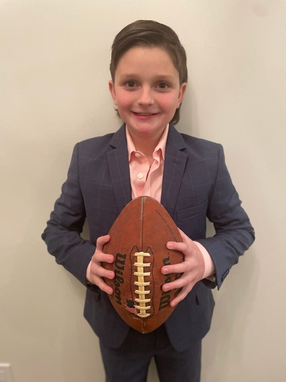 Miles Waage, 11, of Waukee, won the Panini "Kid reporter" contest out of 135,000 entrants nationwide. Waage will interview Kansas City Chiefs and Philadelphia Eagles players at Super Bowl Opening Night Monday and attend the Super Bowl on Feb. 12.