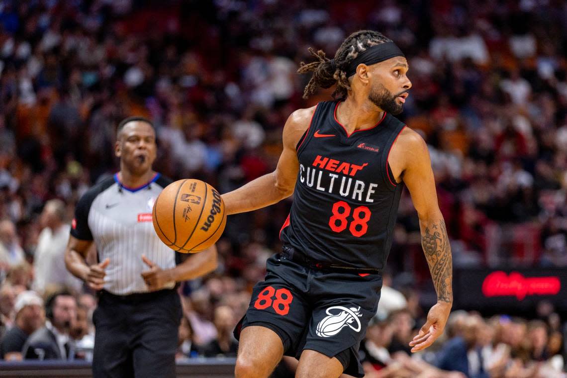 Miami Heat guard Patty Mills (88) dribbles the ball during the first half of an NBA game at Kaseya Center in Miami on March 13, 2024.