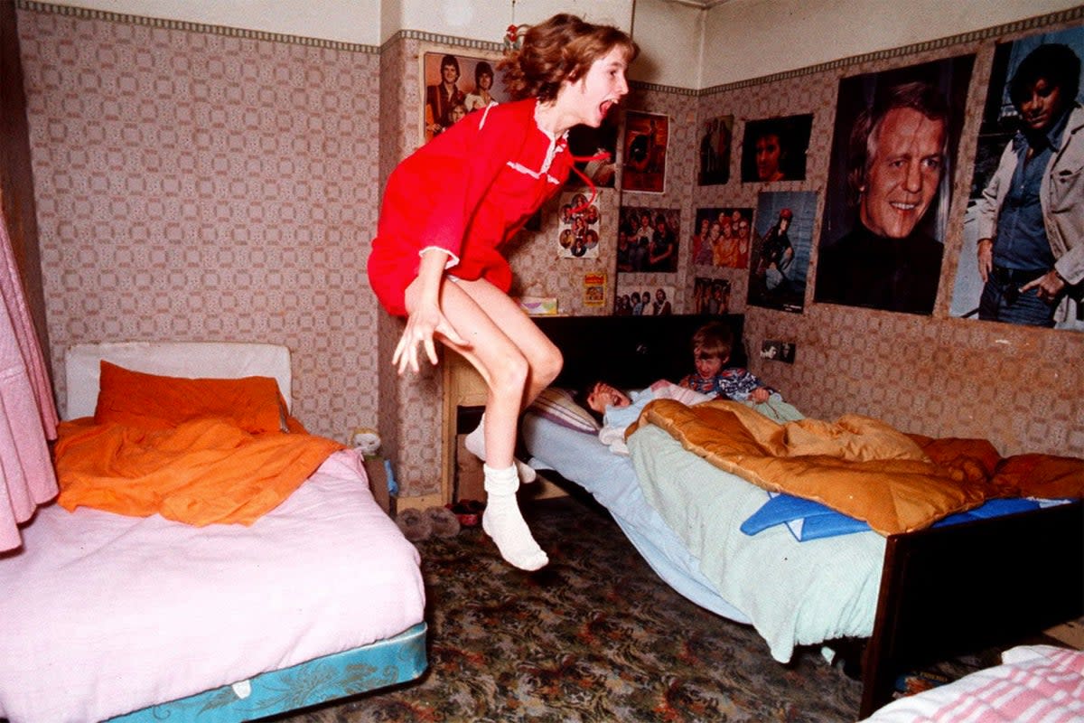 Janet Hodgson apparently flying through the air while two of her siblings cowered in bed in 284 Green Street Enfield in late 1970s. (Graham Morris)