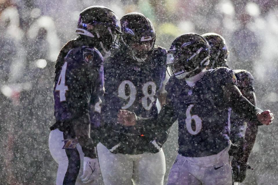 Saturday was a dreary day in Baltimore, but Jadeveon Clowney (24) found reason for joy.