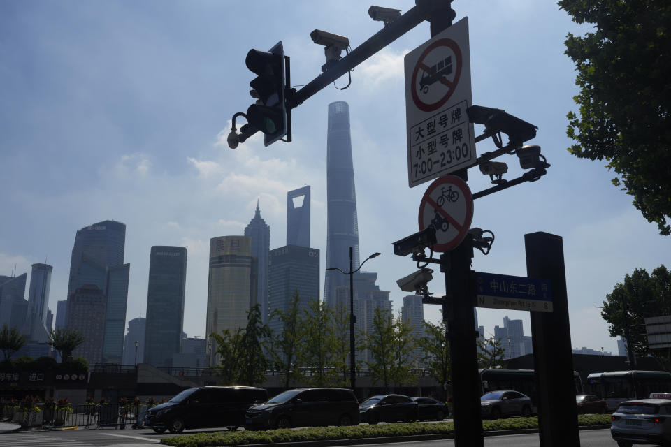 Traffic cameras are seen at a junction near the bund in Shanghai, Thursday, Aug. 1, 2024. (AP Photo/Ng Han Guan)