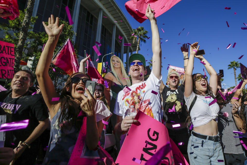 Los Angeles, CA - November 12: Free Britney supporters celebrate after hearing a Los Angeles Superior Court judge today formally has ended the conservatorship that has controlled Britney Spears' life for nearly
14 years outside Stanley Mosk Courthouse on Friday, Nov. 12, 2021 in Los Angeles, CA. (Irfan Khan / Los Angeles Times via Getty Images)