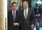 Italian Foreign Minister Luigi Di Maio, left, and Russian Foreign Minister Sergey Lavrov, enter a hall for their talks in Moscow, Russia, Thursday, Feb. 17, 2022. (Shamil Zhumatov/Pool Photo via AP)