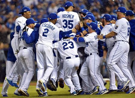 Oct 5, 2014; Kansas City, MO, USA; The Kansas City Royals celebrate after defeating the Los Angeles Angels in game three of the 2014 ALDS baseball playoff game at Kauffman Stadium. Mandatory Credit: Peter G. Aiken-USA TODAY Sports