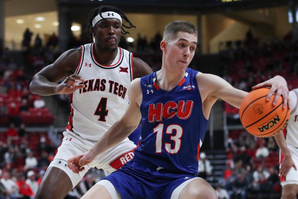 Dec 21, 2022; Lubbock, Texas, USA;  Houston Christian Huskies guard Maks Klanjscek (13) keeps the ball inbounds in front of Texas Tech Red Raiders forward Robert Jennings (4) in the second half at United Supermarkets Arena. Mandatory Credit: Michael C. Johnson-USA TODAY Sports ORG XMIT: IMAGN-500961 ORIG FILE ID:  20221221_lah_aj7_0106.JPG