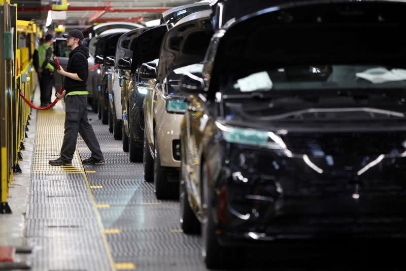 FILE PHOTO: A member of staff works on the production line at Jaguar Land Rover’s factory in Solihull