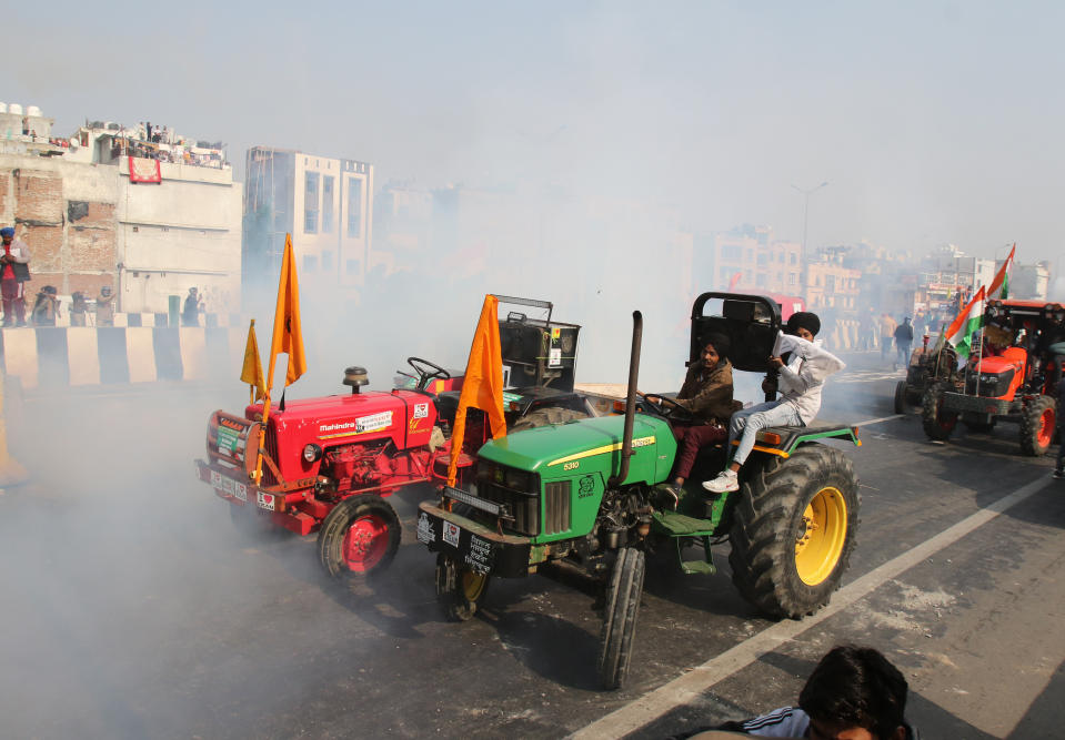 NOIDA, INDIA - JANUARY 26: Indian police use tear gas shell towards farmers during a rally as they continue their protest against the central government's recent agricultural reforms in Noida, India on January 26, 2021. (Photo by Pankaj Nangia/Anadolu Agency via Getty Images)