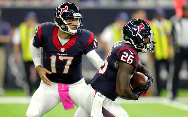 Oct 16, 2016; Houston, TX, USA; Houston Texans running back Lamar Miller (26) takes the handoff from Houston Texans quarterback Brock Osweiler (17) against the Indianapolis Colts during the first quarter at NRG Stadium.