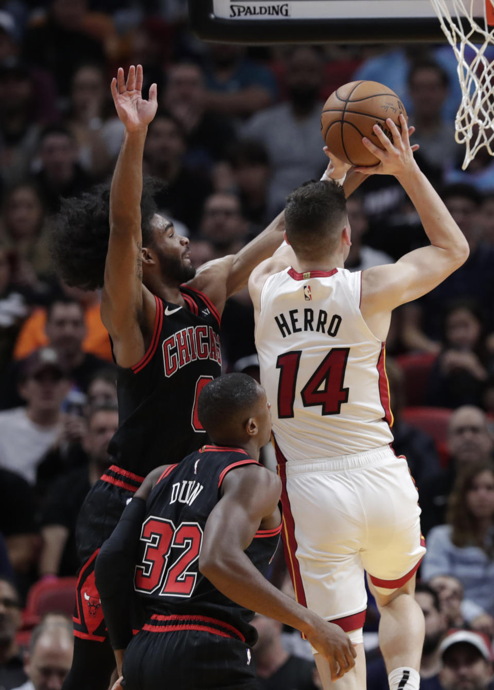 Miami Heat guard Tyler Herro (14) goes to the basket as Chicago Bulls guard Coby White (0) defends during the first half of an NBA basketball game, Sunday, Dec. 8, 2019, in Miami. (AP Photo/Lynne Sladky)