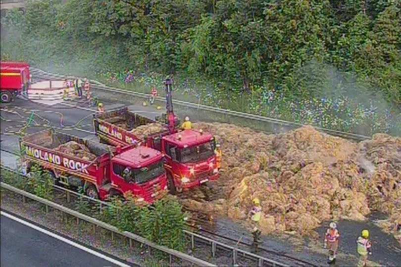 The aftermath of the fire as hay covered the entire carriageway of the M6 northbound at junction 2 near Coventry