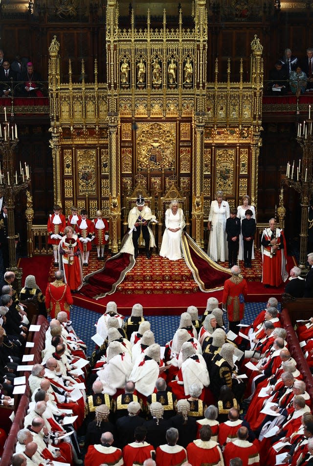 Peers shown listening to the King read the King's Speech