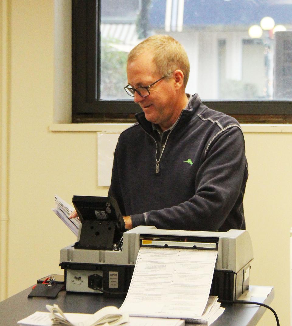 Ken Gibson, owner of Liberty Systems, checks over ballot information before starting the retabulation process at the Livingston County Historic Courthouse Wednesday morning.