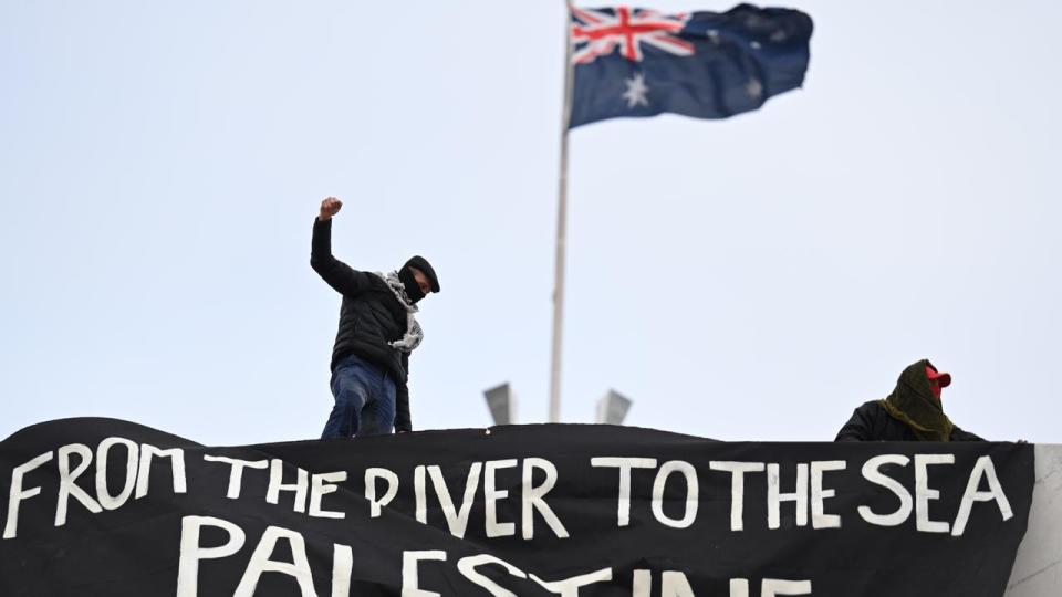 The roof protest started after 10am on Thursday, the final sitting day before the long winter break. Picture: NewsWire/ Martin Ollman