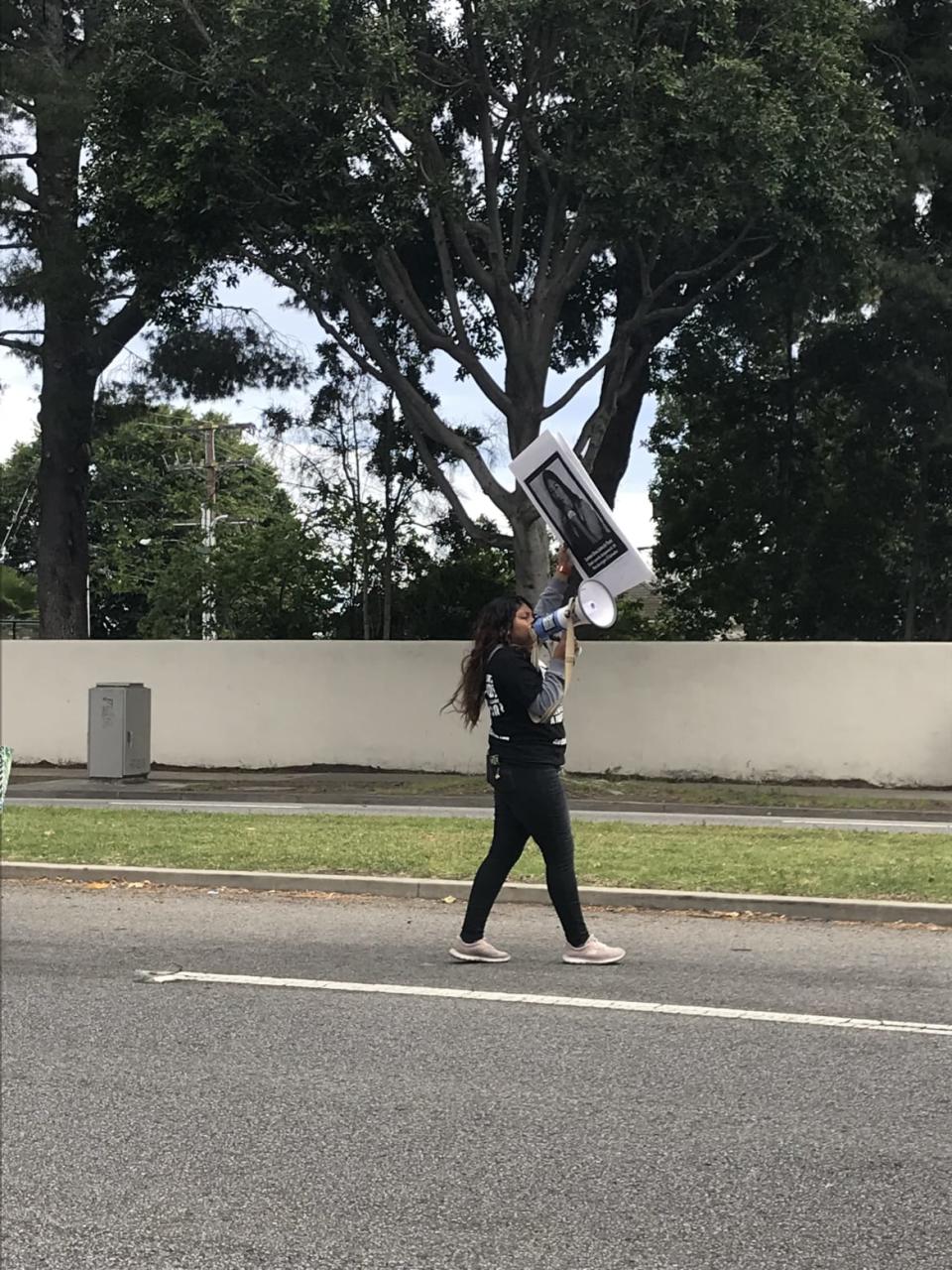 <div class="inline-image__caption"><p>Protestor Michelle Xai outside of the Trump Beverly Hills fundraiser</p></div> <div class="inline-image__credit">Tarpley Hitt</div>