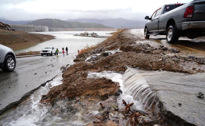 Water run off the hillside onto the Centimudi Boat Launch on Lake Shasta near Shasta Dam on Sunday, Jan. 8, 2023.