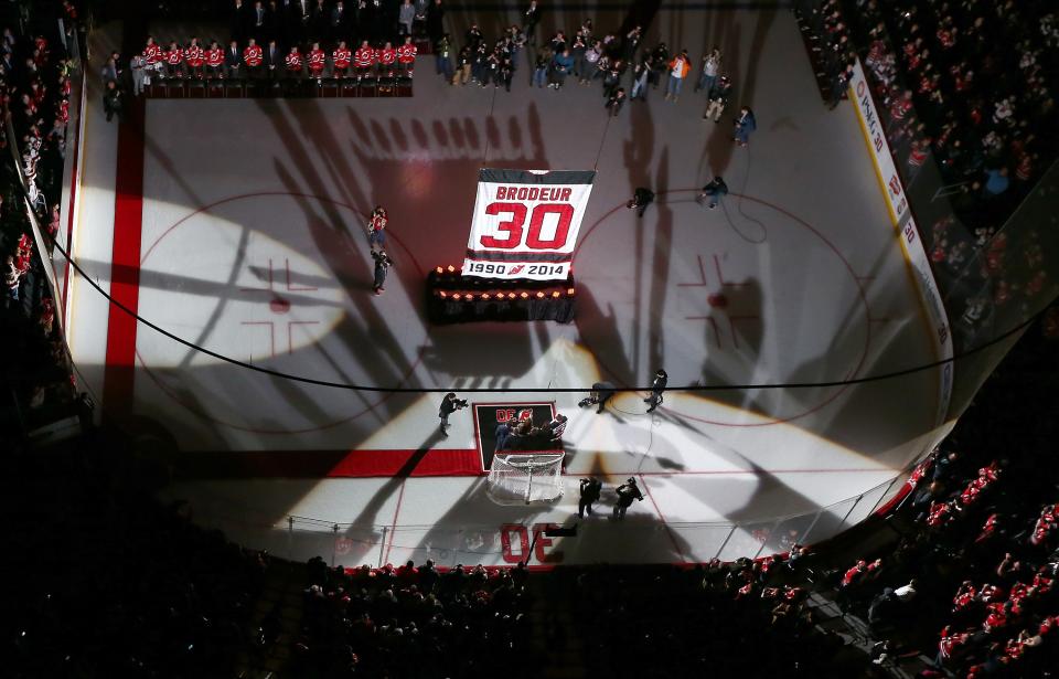 NEWARK, NJ - FEBRUARY 09:  Former New Jersey Devils goaltender Martin Brodeur and his family watch as his banner is lifted during his jersey retirement ceremony before the game between the New Jersey Devils and the Edmonton Oilers on 9, 2016 at Prudential Center in Newark, New Jersey.  (Photo by Elsa/Getty Images)