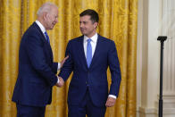 President Joe Biden shakes hands with Transportation Secretary Pete Buttigieg during an event to commemorate Pride Month, in the East Room of the White House, Friday, June 25, 2021, in Washington. (AP Photo/Evan Vucci)