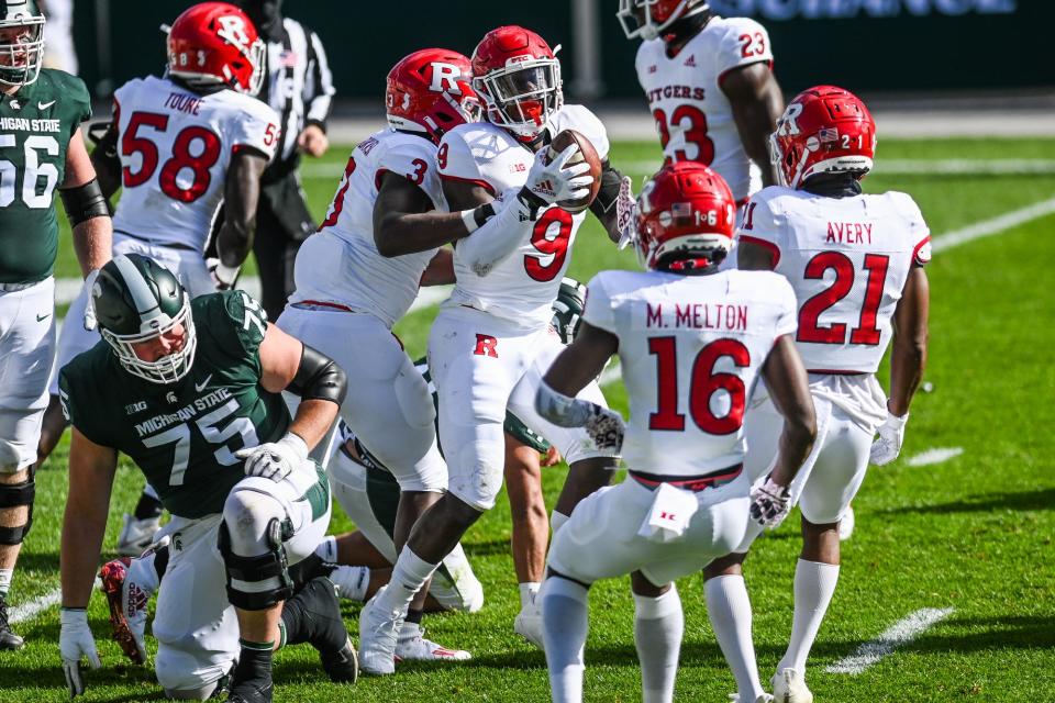 Rutgers' Tyreek Maddox-Williams, center, celebrates after recovering a fumble by Michigan State's Rocky Lombardi during the first quarter on Saturday, Oct. 24, 2020, at Spartan Stadium in East Lansing. 