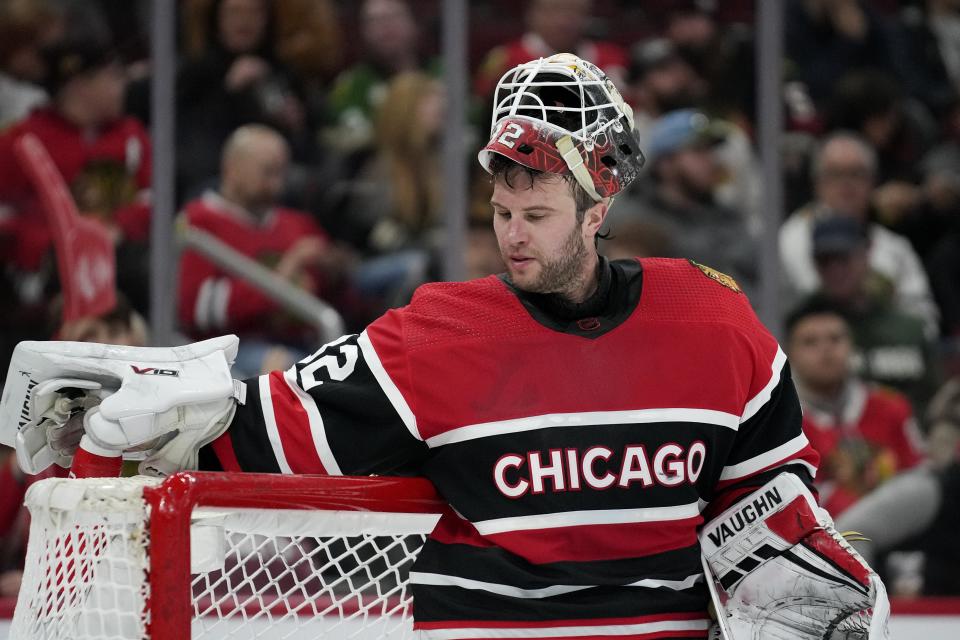 Chicago Blackhawks goaltender Alex Stalock prepares for overtime after the third period of an NHL hockey game against the Calgary Flames, Sunday, Jan. 8, 2023, in Chicago. The Chicago Blackhawks won the game in overtime 4-3. (AP Photo/Erin Hooley)