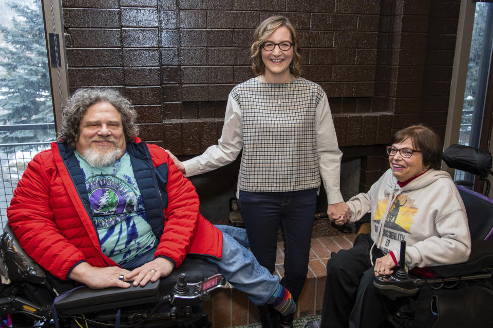 FILE - This Jan. 24, 2020 file photo shows co-directors Jim LeBrecht, left, and Nicole Newnham, center, from the documentary "Crip Camp" with film subject Judith Heumann during the 2020 Sundance Film Festival in Park City, Utah. (Photo by Charles Sykes/Invision/AP, File)