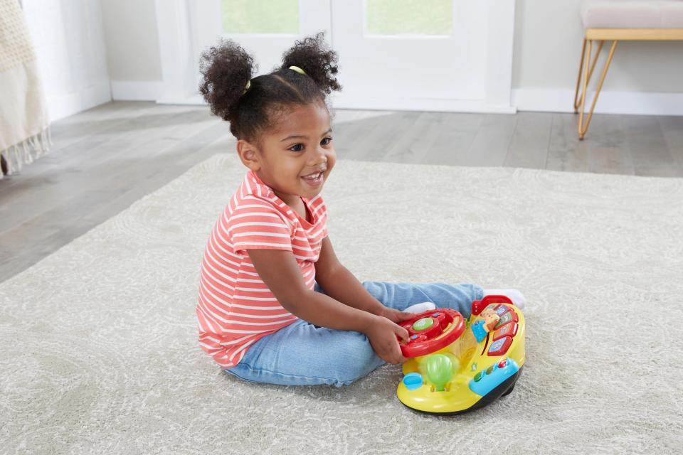 A child playing with the multi-colored toy