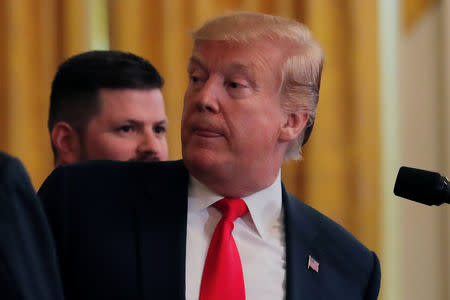 U.S. President Donald Trump hosts participants of the Wounded Warrior Project Soldier Ride, after the release of Special Counsel Robert Mueller's report, in the East Room of the White House in Washington, U.S., April 18, 2019. REUTERS/Lucas Jackson