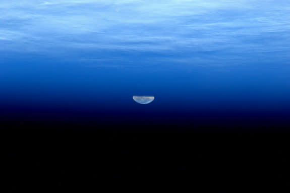 Flattened moonbeams appear to look like liquid in this image of the supermoon. The image was taken by André Kuipers from aboard the ISS on May 5, 2012.